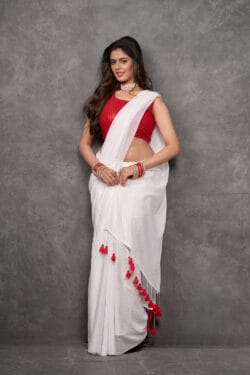 Cheerful Ivory White Mul Cotton saree with Scarlet Red tassels | By Nikunj Khatri 2025